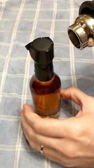 sealing a whiskey bottle with a heat gun