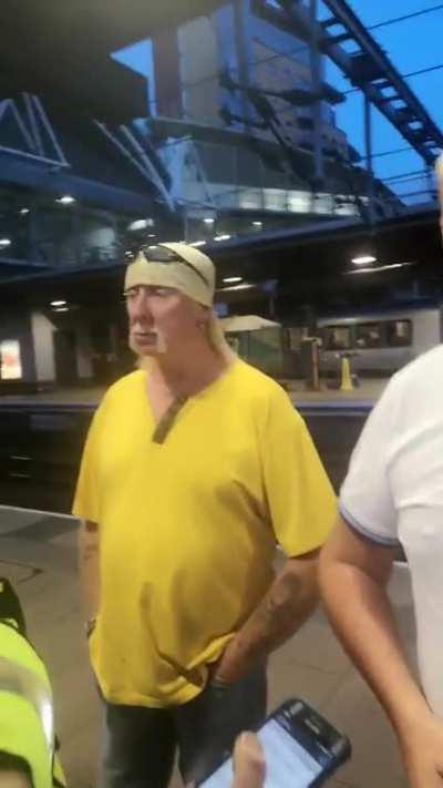 Police think man in train station is wearing fancy dress (Hulk Hogan) but he's in his normal attire, hysterical reaction from his friends