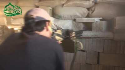 Yarmouk Army PKM gunner observes an SAA soldier working on his sandbagged position and engages him with a burst of fire - 9/3/2014