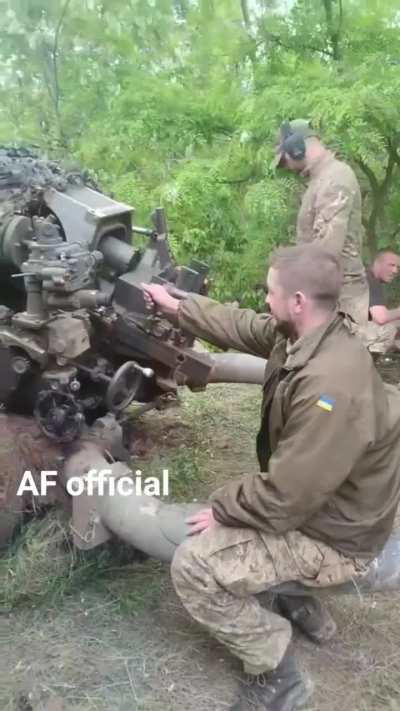 Ukrainian gunners fire their M119/L119 105mm light howitzer at a Russian target.