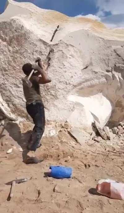 A man vs a rock