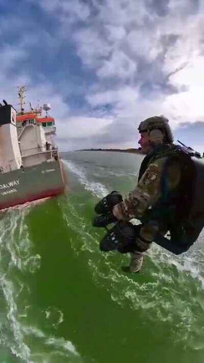 Richard Browning boarding a ship with a jetpack