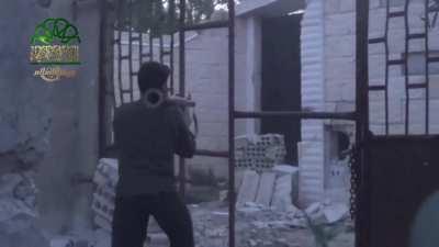 Jaysh al-Islam fighter uses an RPG at point blank range while storming SAA positions in al-Malihah - 2014