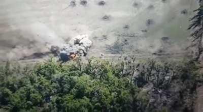 Two Russian BMP's drive headlong into a minefield, Ukrainian drone watches the results unfold