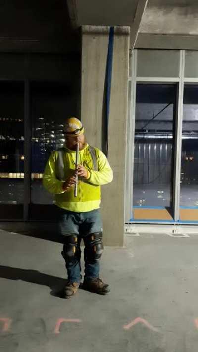 Here, I an Ironworker play the Irish low Whistle while on my break,working on a skyscraper.