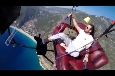 Man Paragliding on a couch