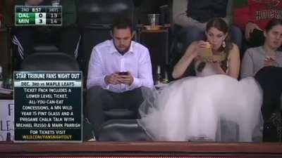 They had a morning wedding so they could make it to the game. She actually turned him into a hockey fan :)