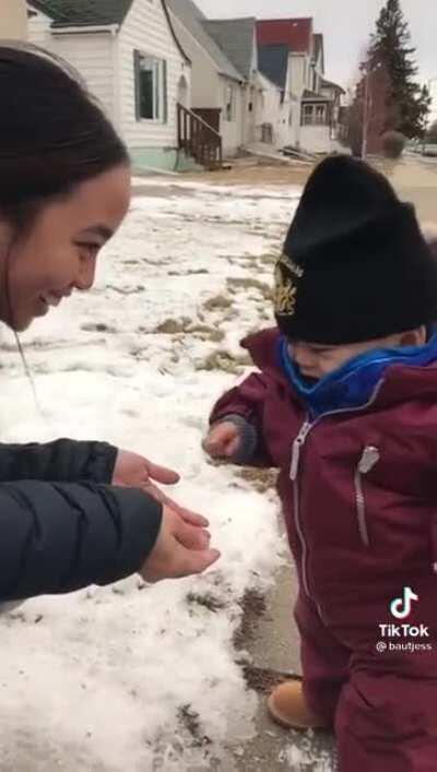 Baby thinks snow is hilarious