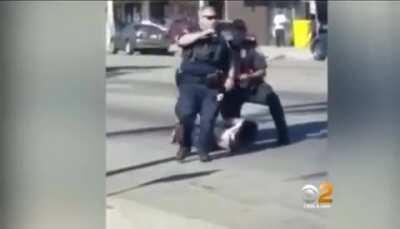 Federal Officers shown kicking handcuffed suspect in the head