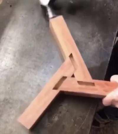 Wood contraption hammered into place