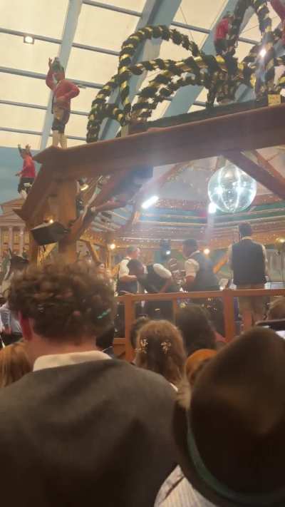 Guy trying to climb the stage at Oktoberfest 