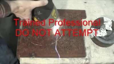 HMB while I use this 1000W burning laser to vaporize and blast rust from this steel plate and then run it over my fingers.