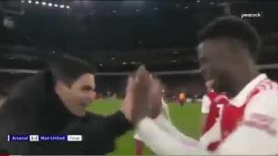 Arteta saying &quot;I told you!&quot; to Saka after the game ends. Probably referring to Saka long range strike in the 2nd half.