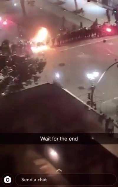 Rioters hit police with a firework - Oakland, CA