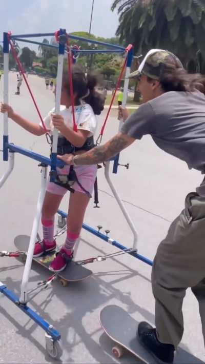 Boarder uses modified frame so these kids can experience skateboarding for the first time