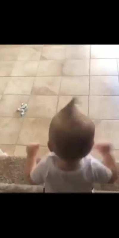 Kid does a head stand