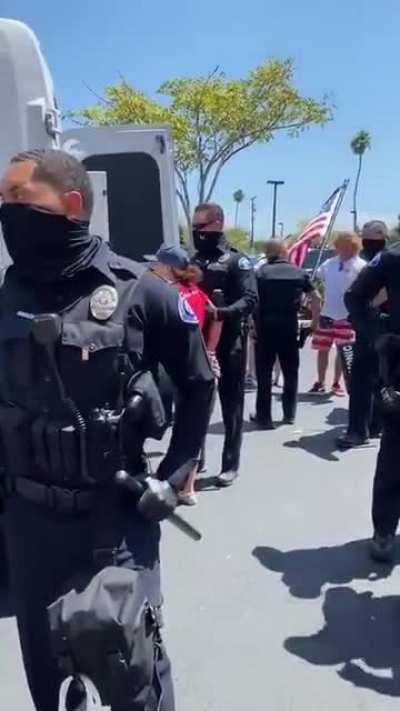 Anti-maskers who were locked inside by a store manager in Costa Mesa being arrested