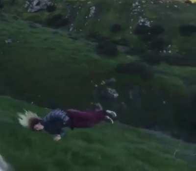 Trying to surf a grassy hill