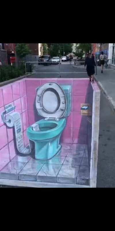 A huge toilet in the street