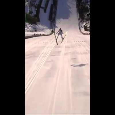 Drone POV of a long distance ski jump