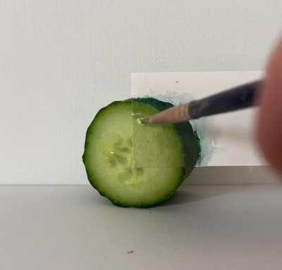 Blending a painting with a real cucumber