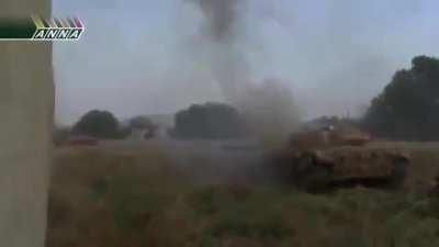 An SAA T-72, flanked by BMP-2s, shrugs off an incoming RPG while engaging targets - Daraya - 2013