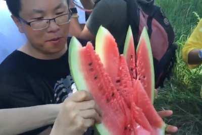 Mongolian way of cutting watermelon