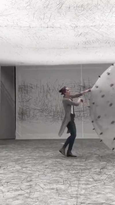 Interactive art exhibit that draws on the walls, floors, and ceiling