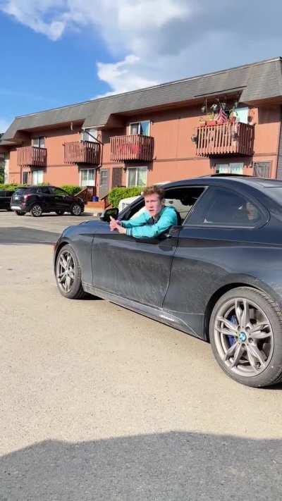 BMW owner has a BMW owner moment over having his picture taken.