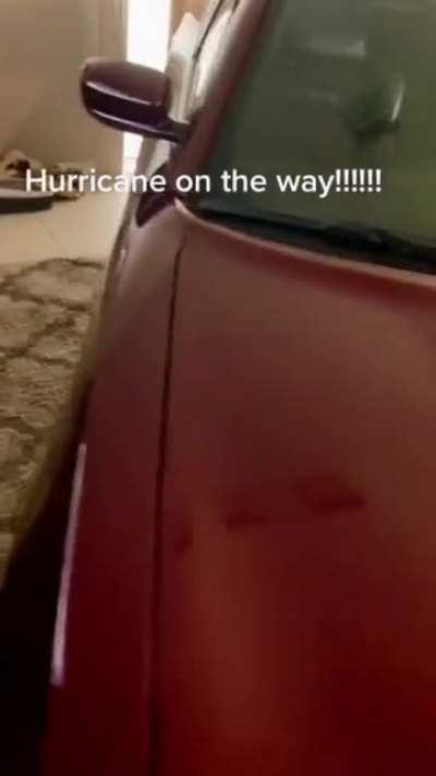 Guy puts Dodge Charger in his living room to protect it from Hurricane Ian