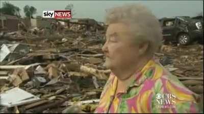 Tornado survivor finds dog buried alive under rubble in the middle of a news interview.