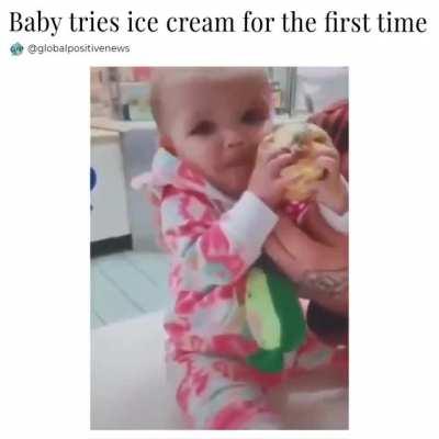 Baby tries ice cream for the first tike