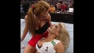 Mickie kissing Trish