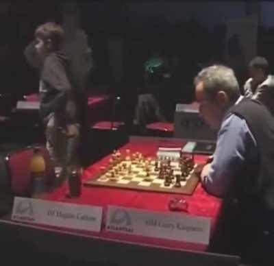 13-year-old Magnus Carlsen gets bored against the Chess Legend Kasparov in 2004. The game ended in a draw