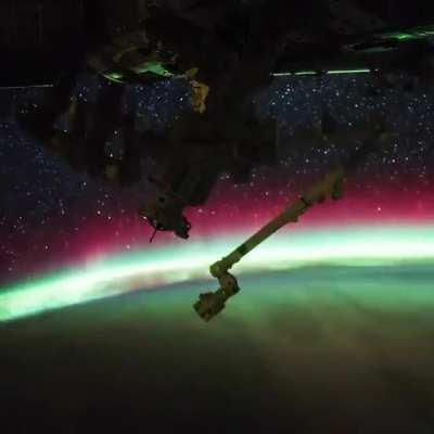 Aurora meets sunrise in space