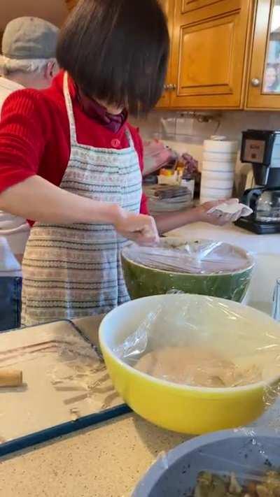 My aunt making dumplings for everybody