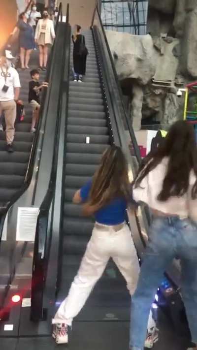 Stopping traffic on an escalator for “content.”