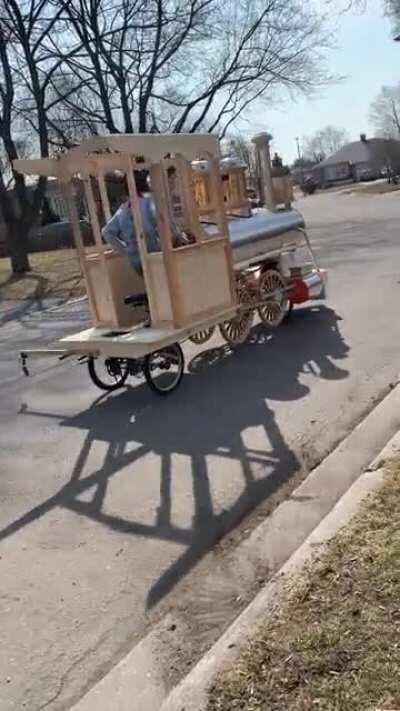 This cool bike/train thing that this kid in my neighbourhood made.