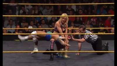 Charlotte stretches Alexa out in a backbreaker submission making it “difficult for her to breathe”