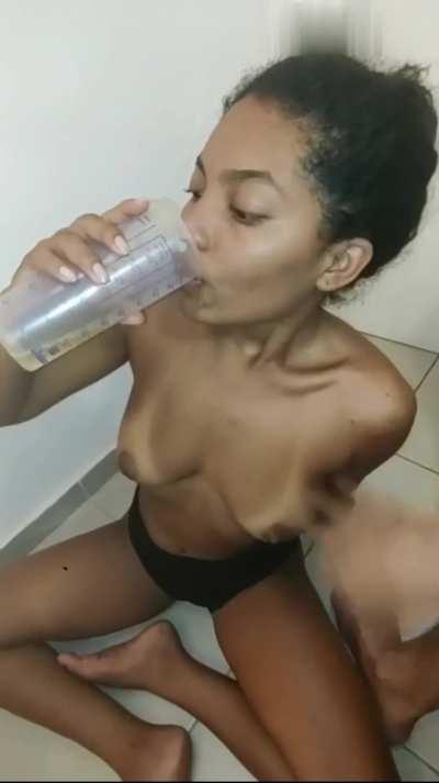 She proves to be a good girl by drinking her own pee and his