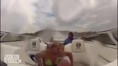 Angry bald dude driving a speed boat