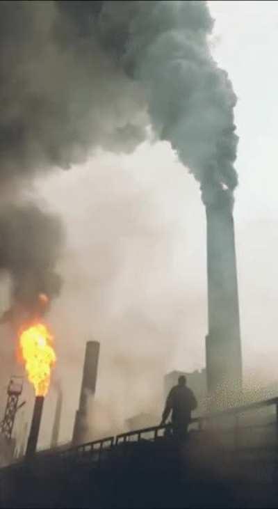 Lighting up a smoke stack.