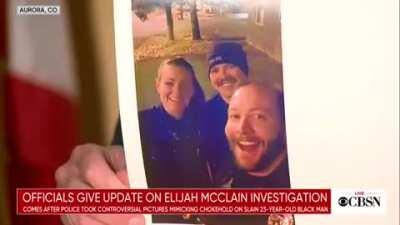 Aurora police chief shows the photos of three former officers smiling and reenacting a chokehold near the site of Elijah McClain's arrest