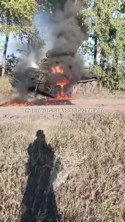 A Russian soldier films his burning tank after being destroyed by Ukrainian forces. Date and location unknown.