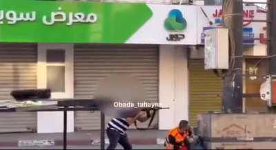 Red crescent (red cross) Palestinian medic taking active part in battle