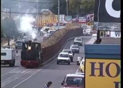 A street running, sugar cane steam train in Queensland in the late 90s/early 2000s. Fired with bagasse (sugar cane processing waste) from the sugar mill.