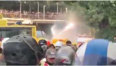 Thailand protesters use rubber ducks to block water cannons