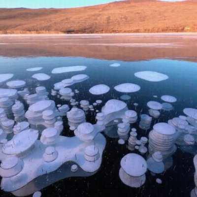 Methane bubbles trapped in two meters of thick ice in Lake Baikal, Russia, the world's deepest and largest freshwater lake.