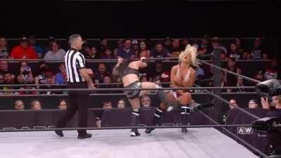 Toni Storm gets an unintentional low kick from Diamanté