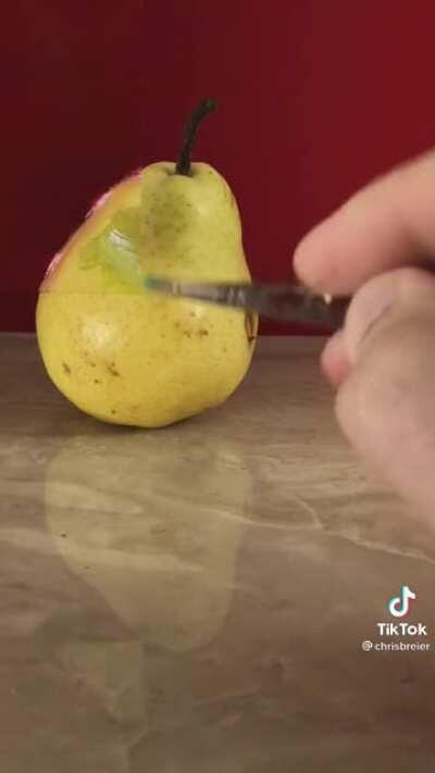 The way this guy matched the pear and the background on paper